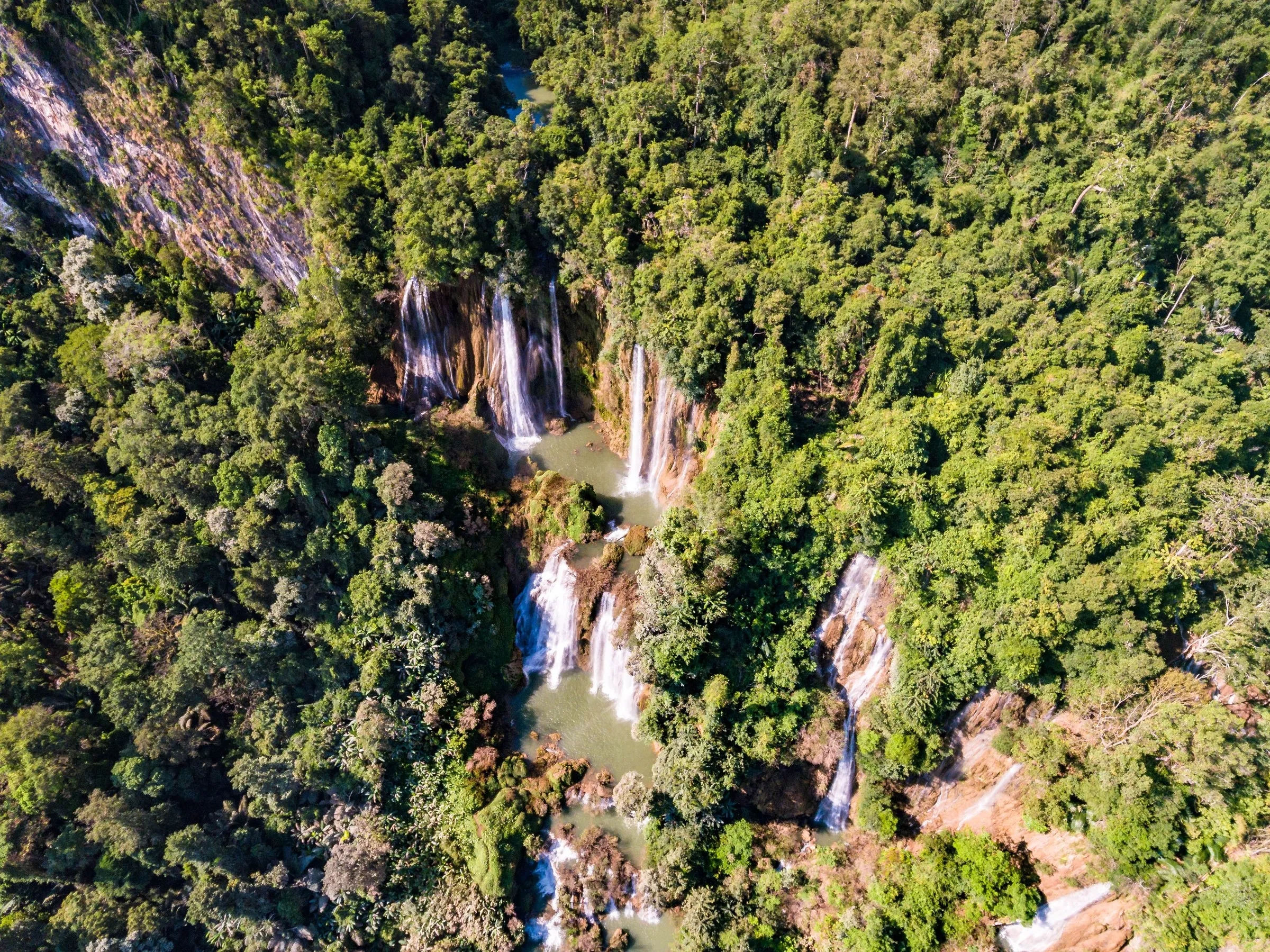 Aerial view of Thi Lor Su waterfall cascading over jungle cliffs in Umphang.